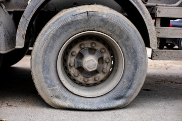 Fototapeta na wymiar Old and dirty flat tire