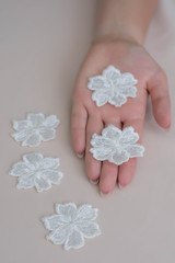 Texture lace fabric. lace on white background studio. thin fabric made of yarn or thread. a background image of ivory-colored lace cloth. White lace on beige background.