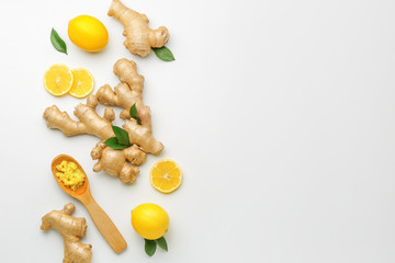 Fresh ginger and lemon on white background