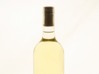 Close up of a bottle of white wine unlabelled
