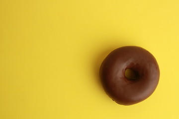 chocolate bagel on colorful background