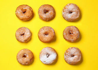 Sweet tasty donuts on color background