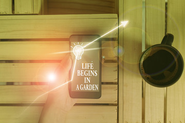 Conceptual hand writing showing Life Begins In A Garden. Concept meaning Agriculture Plants growing...