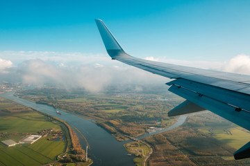 aiplane wing,  landscape aerial and blue sky