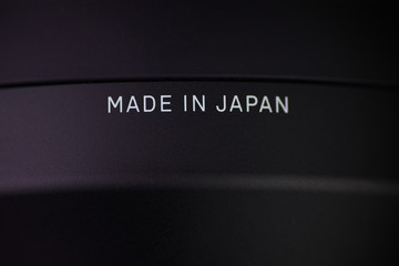 The inscription made in japan on a black object isolated