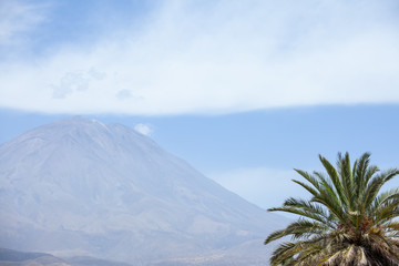 Fototapeta na wymiar El Misti Volcano in Arequipa, Peru, sunny weather, clouds over the crater