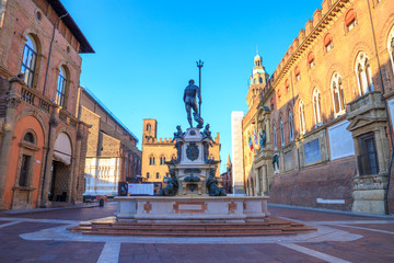 Fountain of Neptune (Fontana di Nettuno) in Bologna, Italy, early in the morning, on a sunny day with clear blue sky. Main tourist attraction on the central square of the Old Town. © Predrag Jankovic