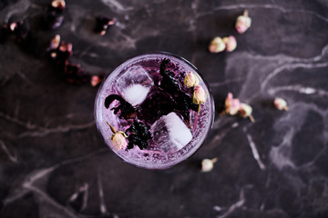 Pink Gin and Tonic cocktail with Hibiscus and Dried Rose Buds