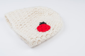 White woolen hat isolated on white background.Copy space