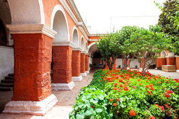 Fototapeta na wymiar Garden with flowers and trees in monastery Saint Catalina, Arequipa, Peru