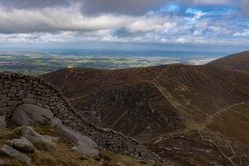 The Mourne wall at Slieve Bearnagh looking down towards The Hares Gap, Mourne Mountains, County Down, Northern Ireland