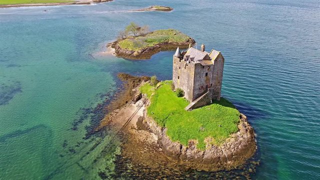 Aerial shot of medieval Castle Stalker on the west coast of Scotland between Fort William and Oban
