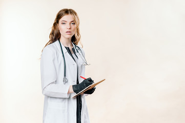 Girl doctor blond young light background studio day beautiful one positive tablet looking smiling concept of remote customer care online patients.