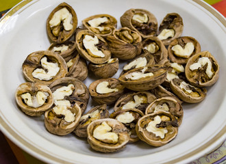 Bowl of walnuts with a thick shell