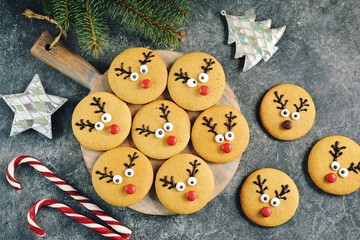 Cute New Year and Christmas gingerbreads Santa Deer. Homemade Christmas baking.