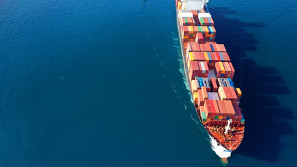 Aerial drone photo of industrial Cargo Container carrier tanker ship cruising Mediterranean open...
