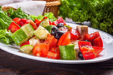 greek salad on dark wooden rustic background