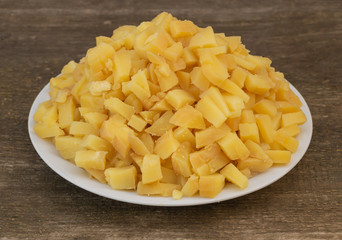 Sliced boiled potatoes, in the process of cooking salad. Natural and beneficial food concept