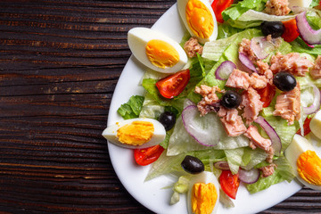 tuna salad on dark wooden rustic background