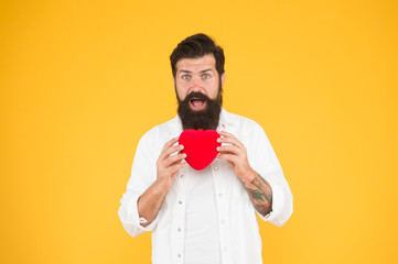 Prescribe medication lower blood pressure cholesterol. Feel pulse check heart rate rhythm. Heart disease. Healthy habits and lifestyle. Monitoring and measuring. Man bearded hipster hold red heart