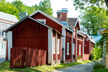 Ancient wooden house buildings in Gamla malmen (the old town) of Pargas town at sunny summer day....