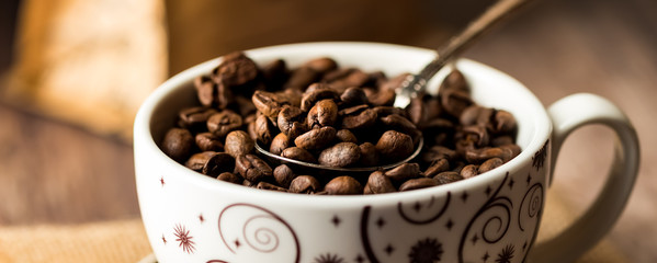 A cup full of coffee beans.