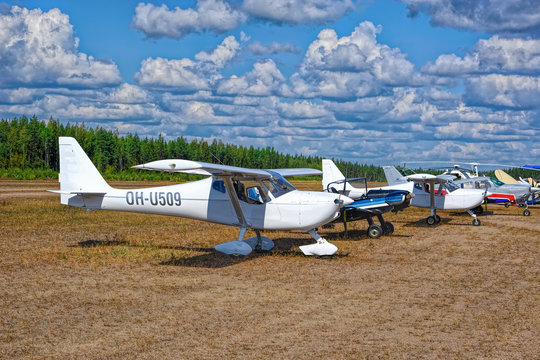 Row of assorted single-engine piston-powered ultralight airplanes displaed on Karhula aviation museum airshow. Kotka, Finland.