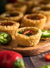 Mini hot pepper jelly tarts.