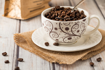 A cup full of coffee beans.