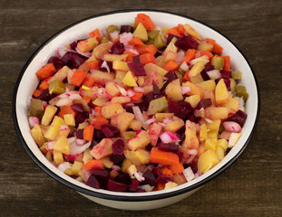 Vegetarian salad of beets carrots onion and potatoes. natural food concept