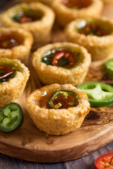 Mini hot pepper jelly tarts.