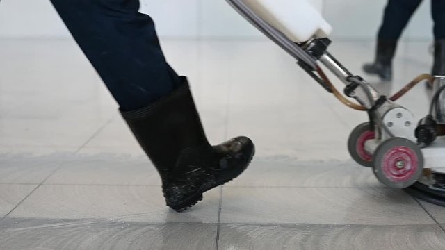Labor cleaning the floor with cleaning machine - Slow motion	