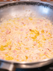Close up of a condiment based on salmon, tomato, red onion, oil, pepper cream
