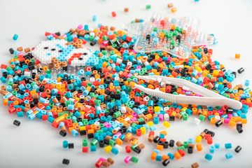Perler beads on the table, set. Toys for leisure and development of creative qualities.