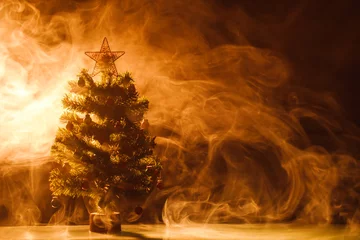 Foto op Plexiglas Christmas tree in ice fog, orange background © nikkytok