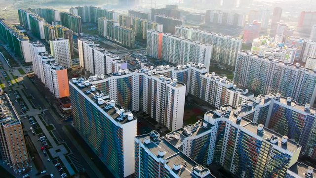 High rise buildings in new modern residential area, aerial view. Journey. Flying above the new colorful houses, concrete jungles concept.