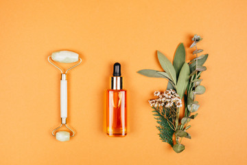 Modern apothecary with natural ingredients. Oil made of herbs herbs. Face roller for self-care....