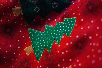 Christmas tree embroidered on a red cloth