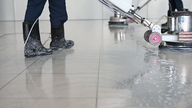 Labor cleaning the floor with cleaning machine - Slow motion	