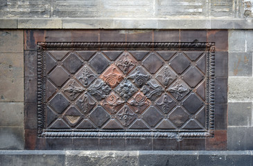 Decorated Ceramic Tile Panel on Stone Wall of Ancient Building 