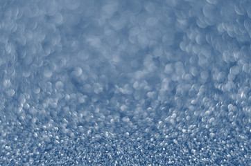 Obraz premium Classic Blue color. Color of the year 2020. Abstract festive bokeh background with shining defocus sparkles. Blurred glitters shimmering dust macro close up, copy space for text logo