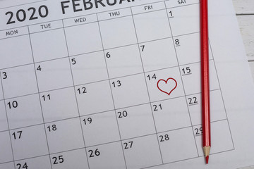 Date February 14 marked in the calendar with a red heart. Valentine's day.