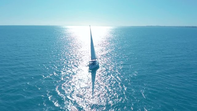 Aerial view. Traditional yacht sailing across sea.