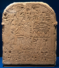 Funerar Stela of the Egyptian young boy Merysekhmet. He is shown sitting on his mother knee.