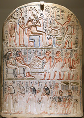 Funeral Stela. Egyptian priest offering food and drink to gods and death person.
