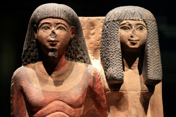 Group a statues of a Egyptian priest and his wife