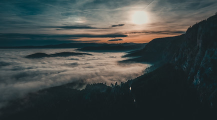 mountain landscape during sunset with a lot of fog