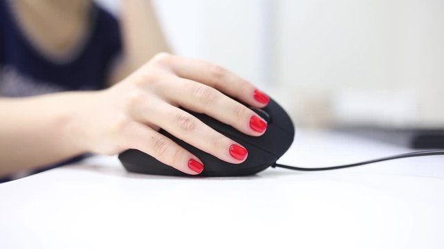 girl's hand uses a vertical ergonomic computer mouse joystick.