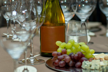 Bottle of Red Wine Cheese Assortment for Snack. Free space for text. 