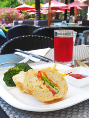 Vegetable sandwich with  french fries and ketchup on white plate